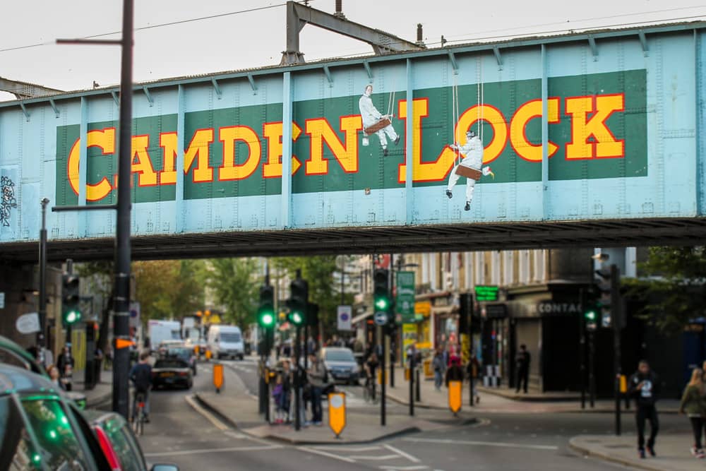 Road sign to Camden Market—staying in this area is a good London travel tip. Road sign to Camden Market in Camden Town—staying in this neighborhood is a good London travel tip.