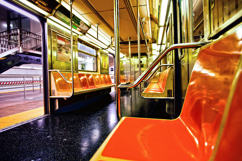 Orange seats of the NYC subway. Travel tip: It's the best way to get around in the city.
