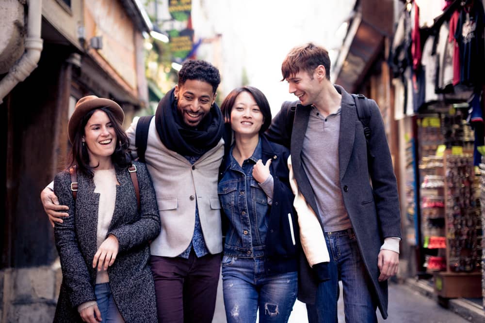 Travel tip: Parisians are friendly (but be polite and speak in French first) Group of a friendly Parisians walk down a street. Travel tip: Parisians are friendlier than you'd think.