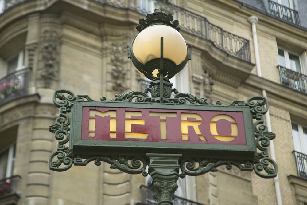 Travel tip: Paris public transportation is fantastic A red and green old-fashioned metro sign in Paris. Travel tip: public transportation in Paris is fantastic.