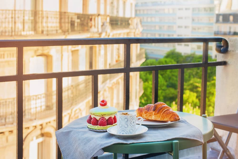 Hotel balcony overlooking Paris below. Travel tip: Paris is more affordable to stay in than you think