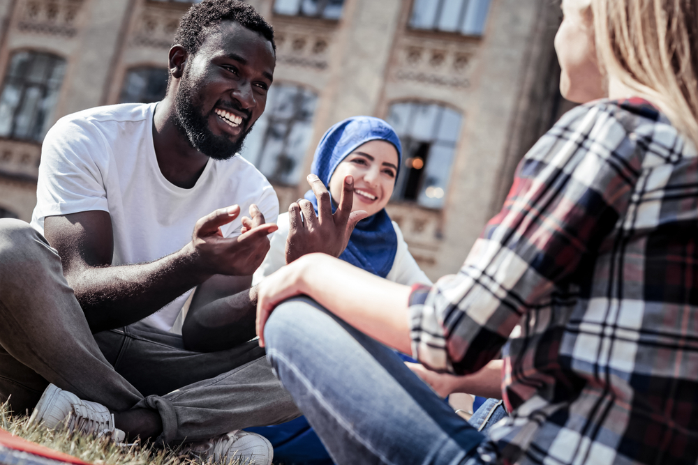 group of young travelers using language app