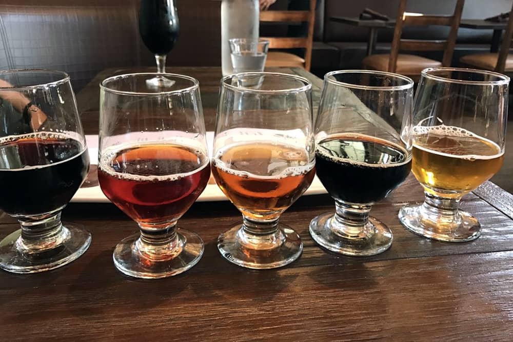 Tasting flight of five beers lined up at Stone World Bistro and Gardens—the perfect pit stop during a San Diego bachelor party