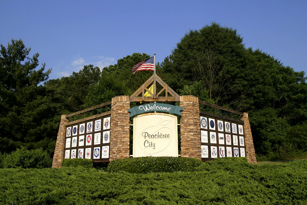 welcome sign at entrance to peachtree city, georgia, a top place to visit in 2019