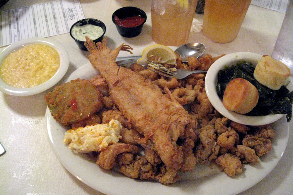 Atlanta is known for history, like Mary Mac's Team Room. Fried fish, seafood, collard greens with sweet tea at Mary Mac's Tea Room—a historic dining room in Atlanta.