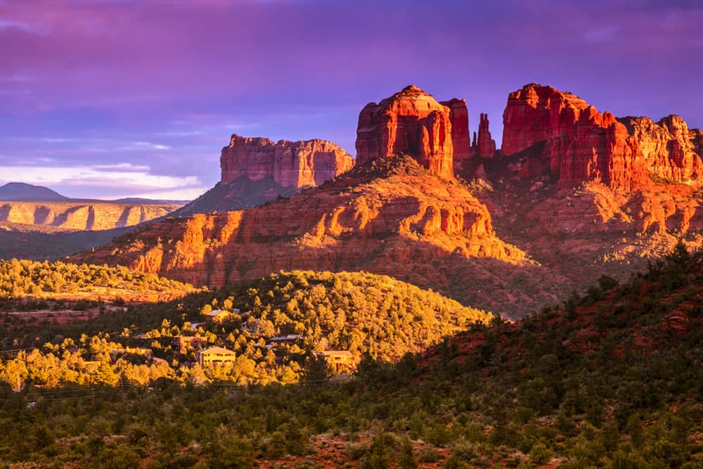  Green hills lace the foreground with Cathedral Rock in the background - Sedona is known for vortexes