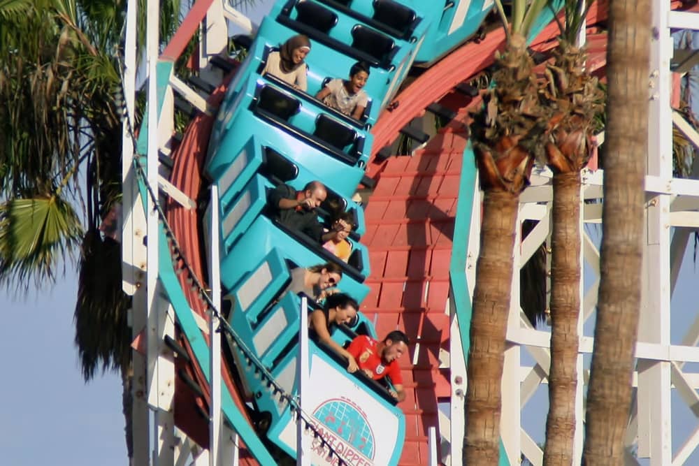 A group of people riding the roller coaster at Belmont Park—a great thing to do in San Diego during Comic-Con