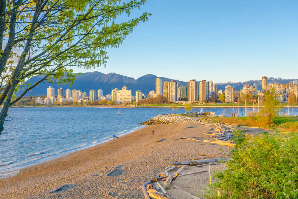 Kitsilano Beach in Vancouver. What is Vancouver known for? Outdoor sports like swimming.