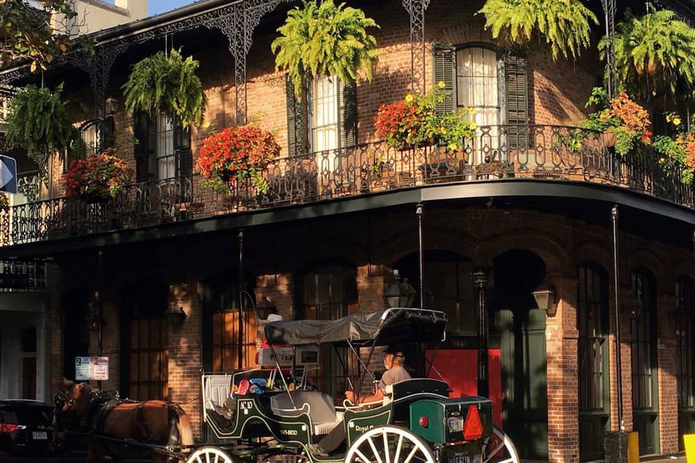 The French Quarter, one of the best places to stay during the New Orleans Jazz Festival The ornate buildings of the French Quarter, the top place to stay during the New Orleans Jazz Festival