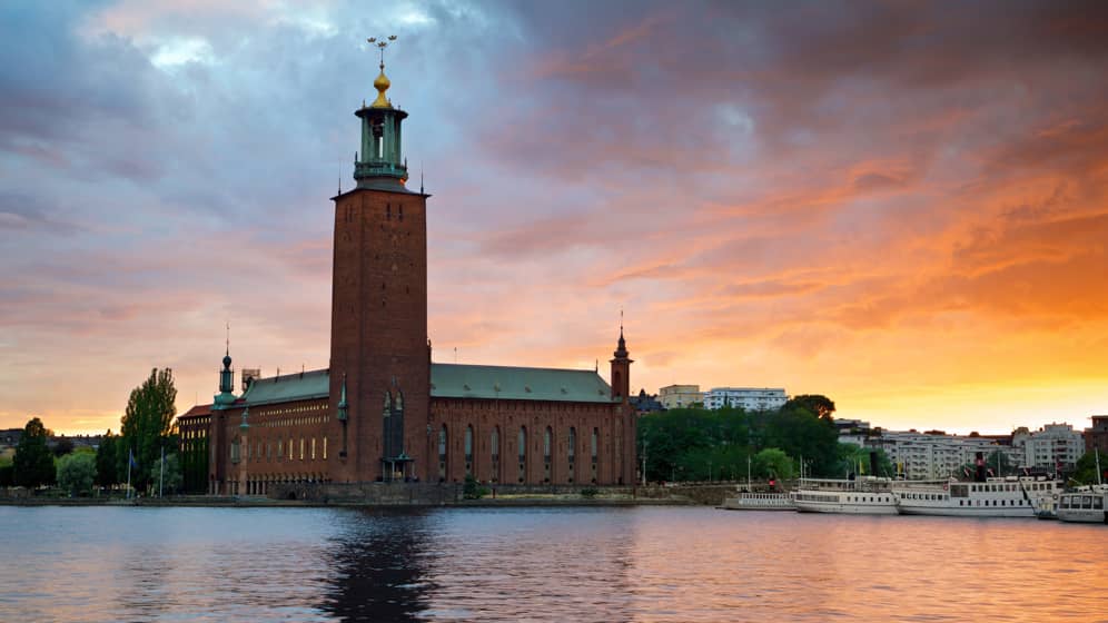 witness the famous stockholm city hall at sunset trip planning